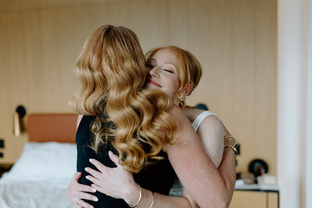A person hugging someone before their wedding. 